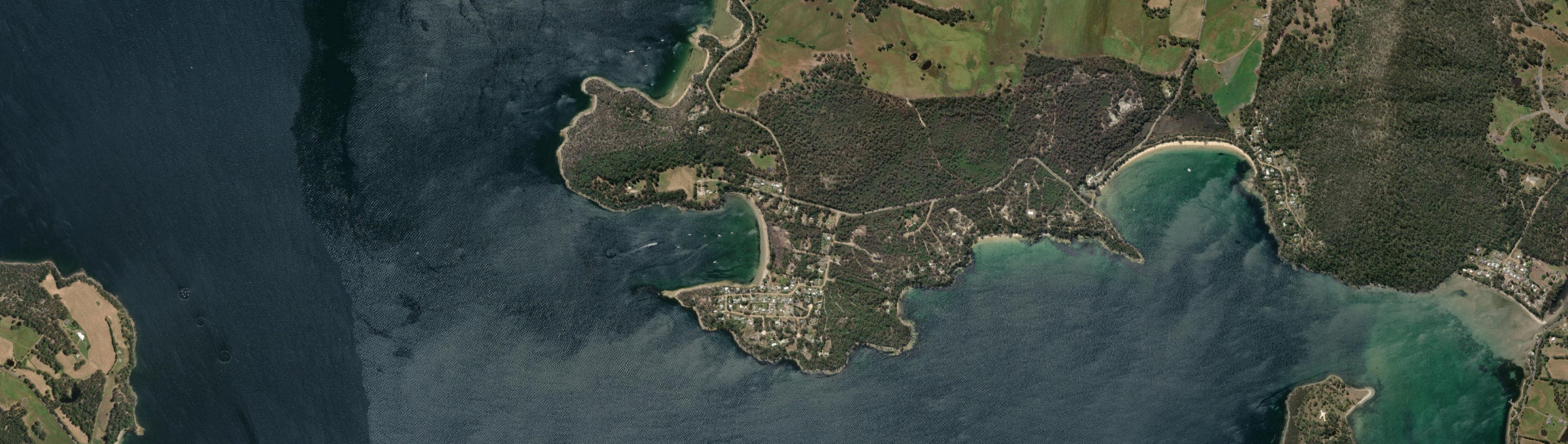 Aerial view of Eggs And Bacon Bay, TAS