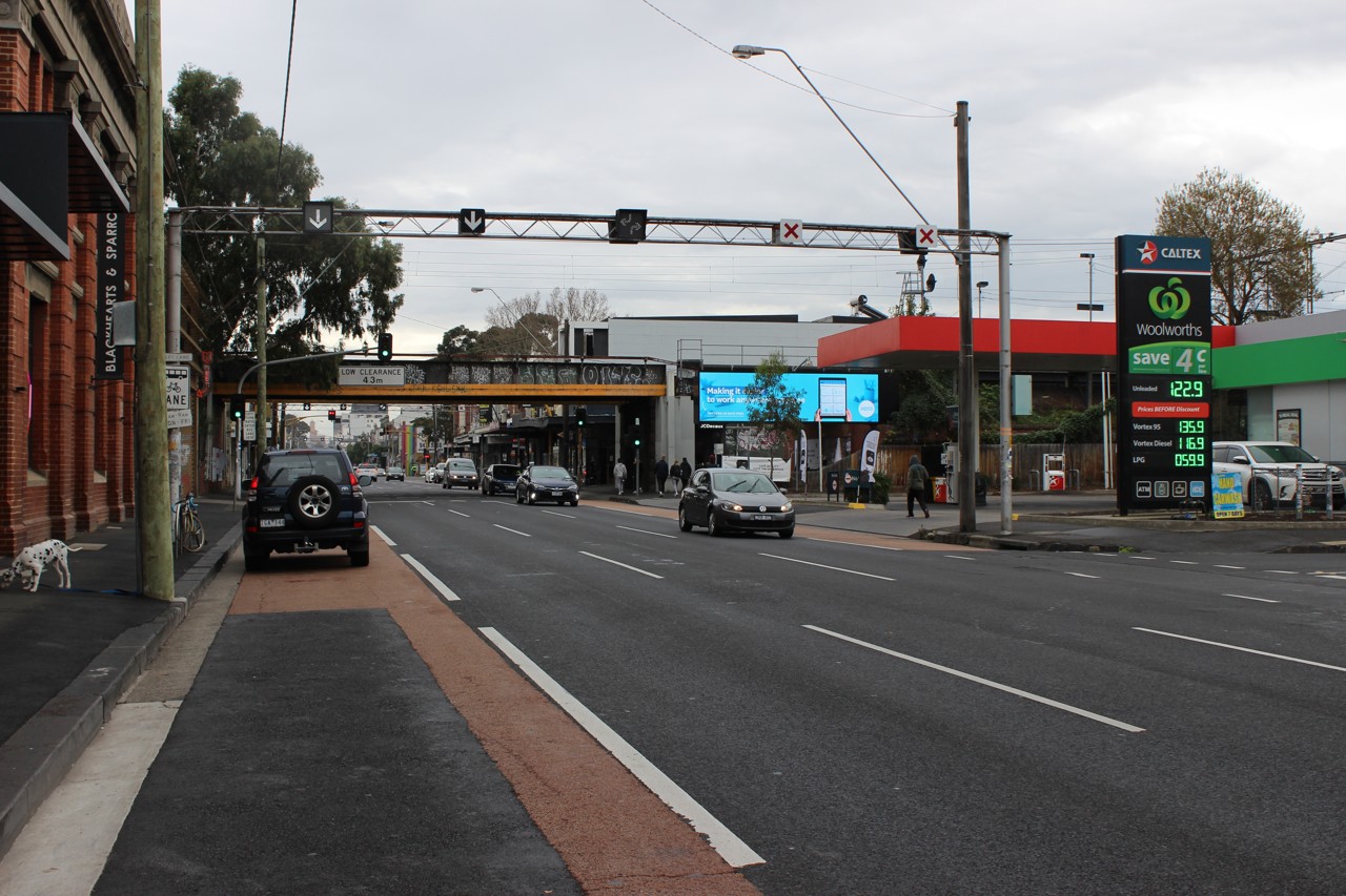 Abbotsford, VIC, Victoria Street near railway bridge with shops