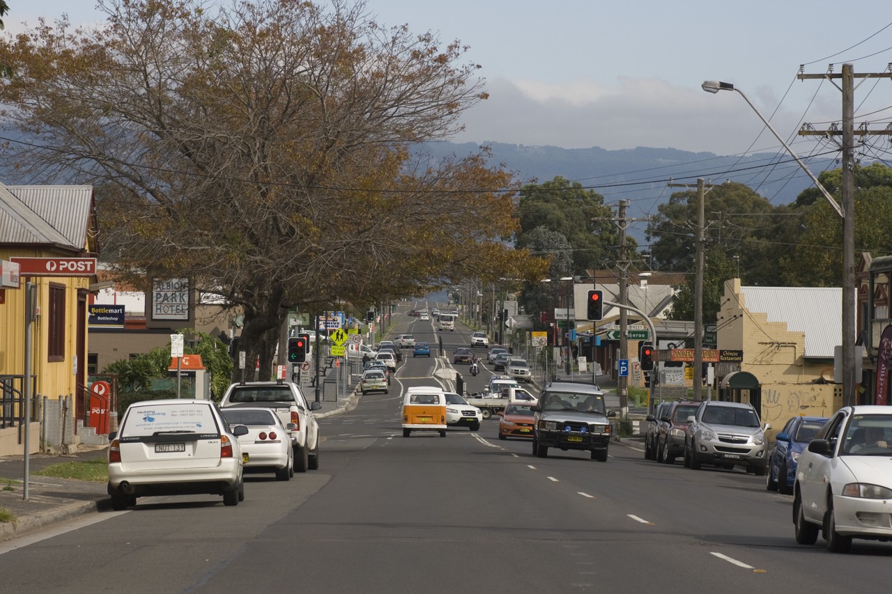 Albion Park, NSW, Busy street with shops and parked cars