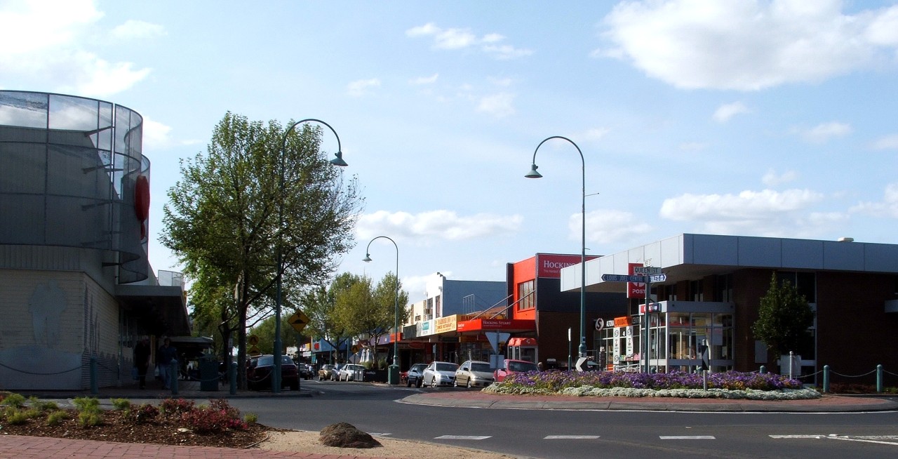 Altona, VIC, Commercial street with shops and trees