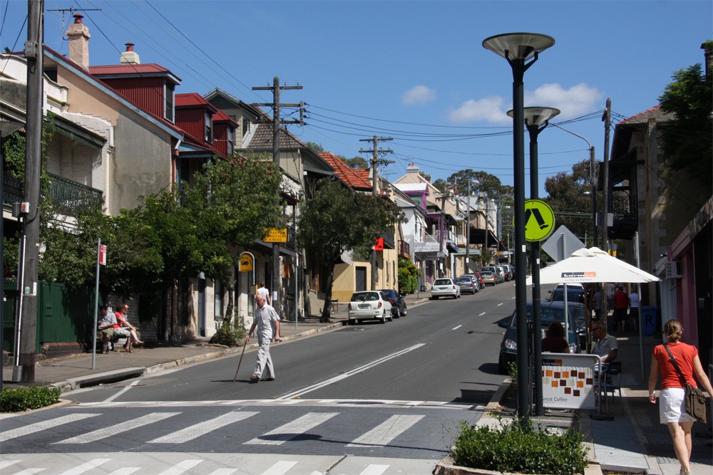 Balmain, NSW — People crossing Darling Street with terraces