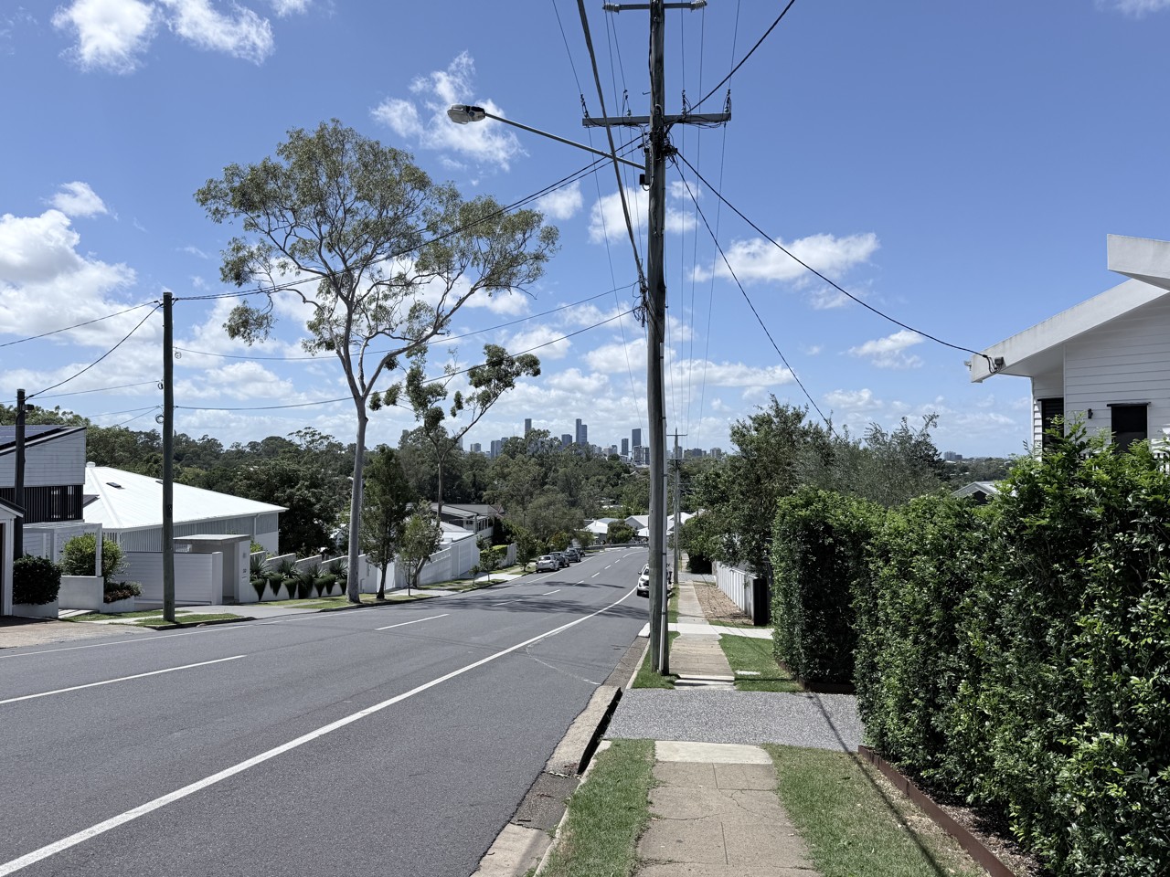 Bardon, QLD, Residential street with city skyline in distance