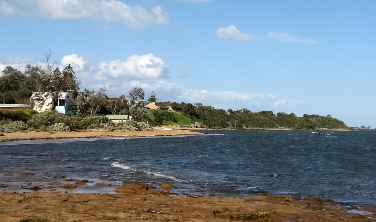 Beaumaris, VIC, Coastal houses above rocky foreshore and beach