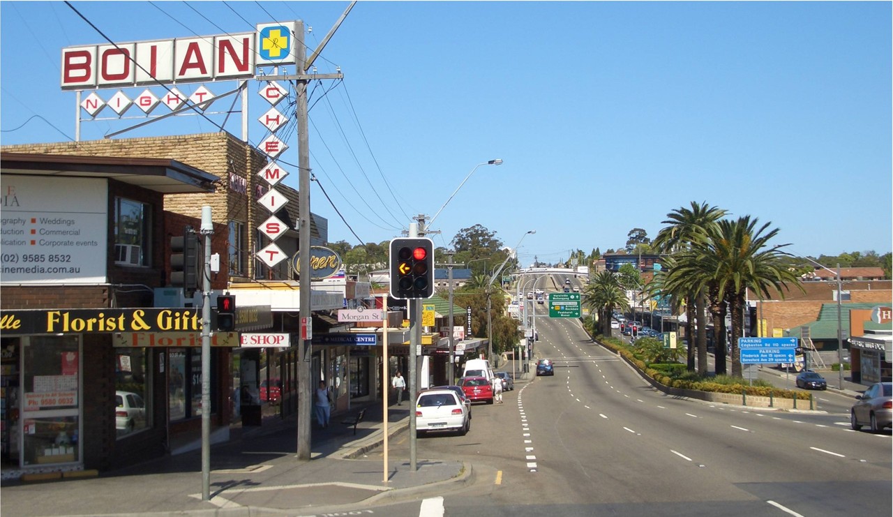 Beverly Hills, NSW, King Georges Road intersection with shops and signs