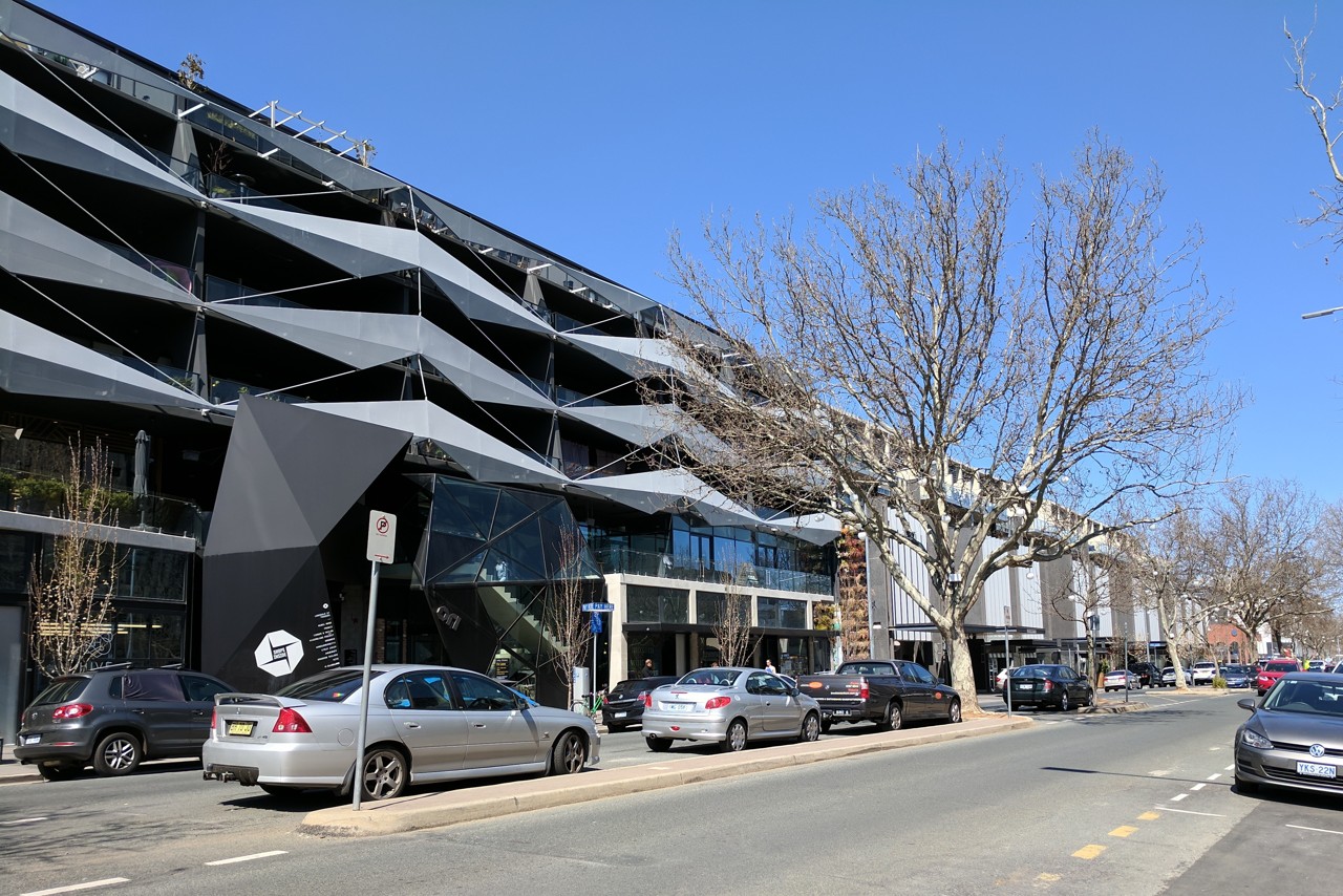 Braddon, ACT, Modern building facade on a tree-lined street