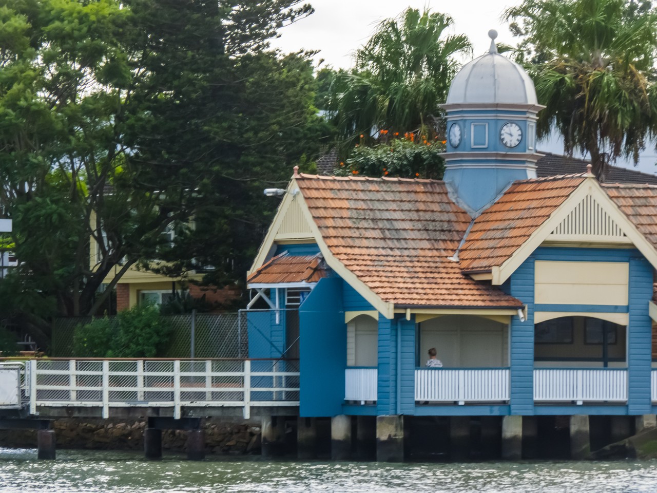Bulimba, QLD, Blue boathouse with clocktower by river