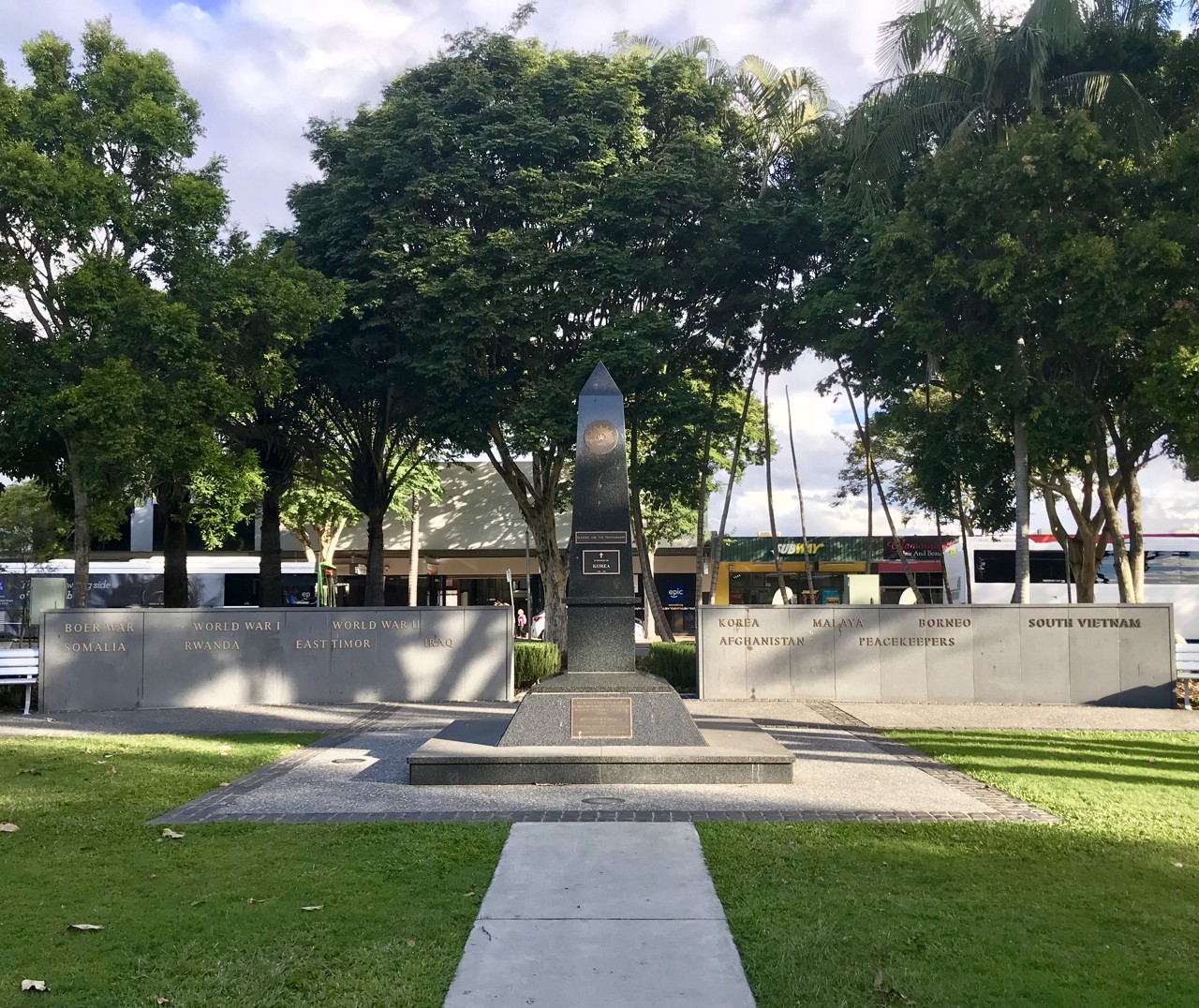 Caboolture, QLD, War memorial with obelisk and surrounding plaques
