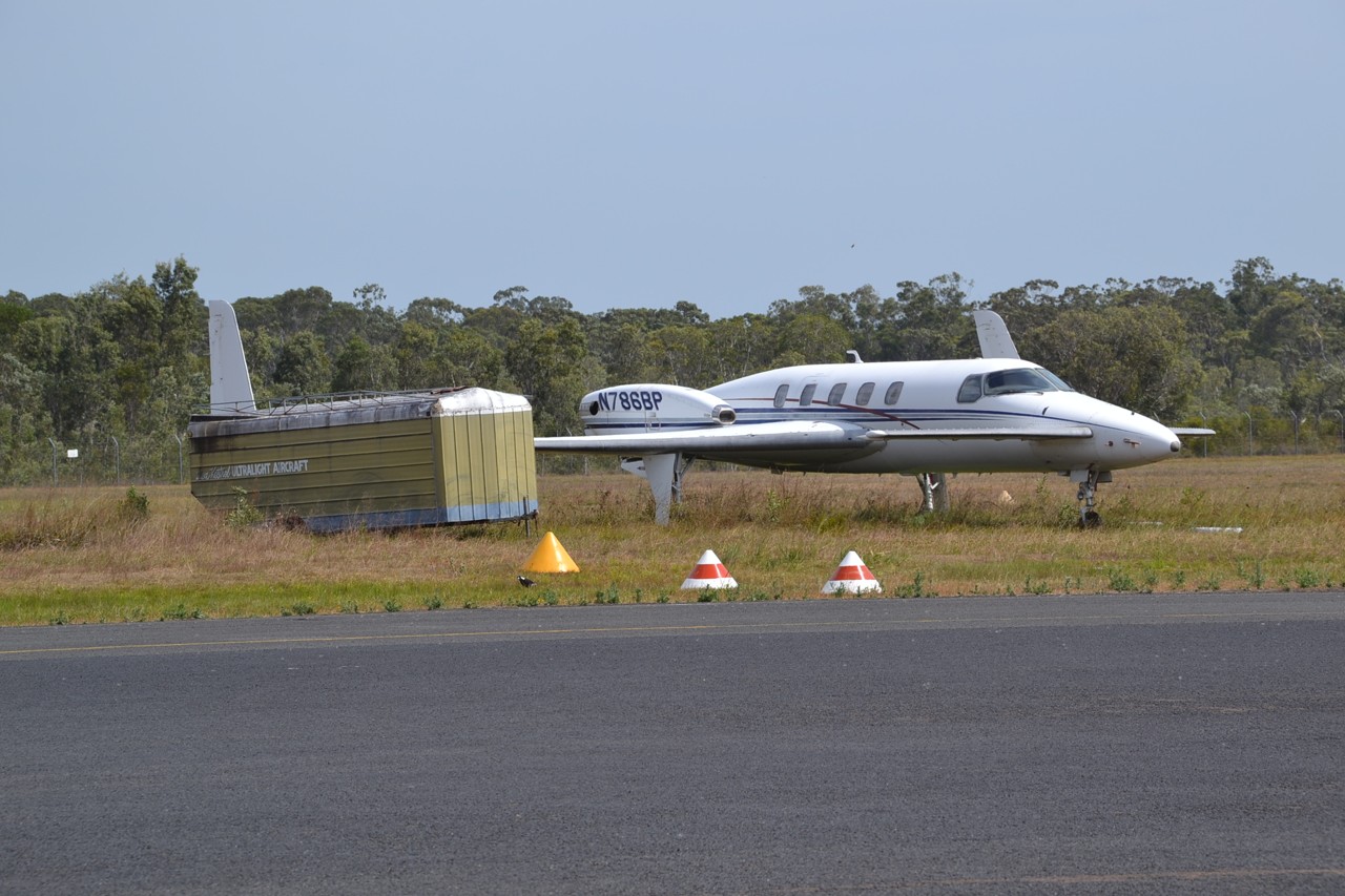 Caloundra West, QLD, Small aircraft parked near a hangar