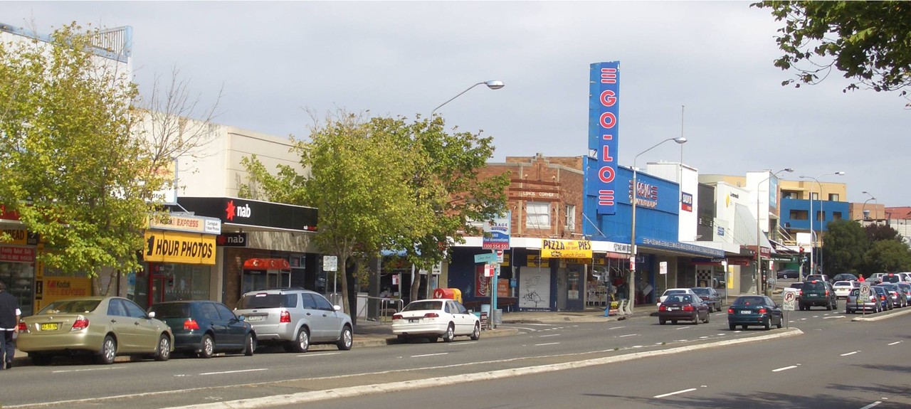 Caringbah, NSW — Shopfronts on Kingsway with traffic and pedestrians