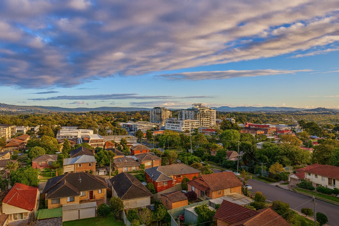 Charlestown, NSW, Residential rooftops with distant city buildings