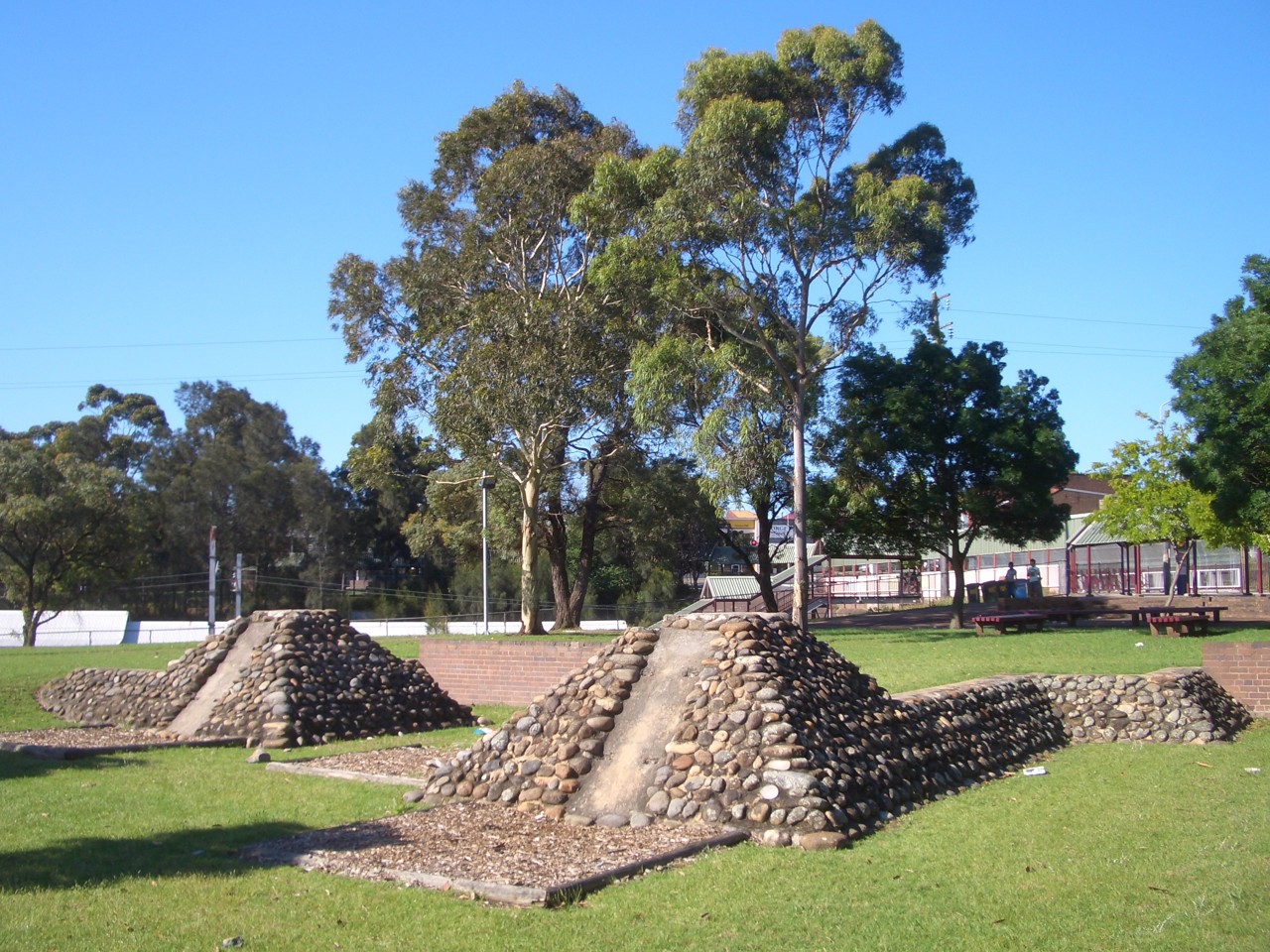 Chester Hill, NSW — Stone sculptures and trees in a park