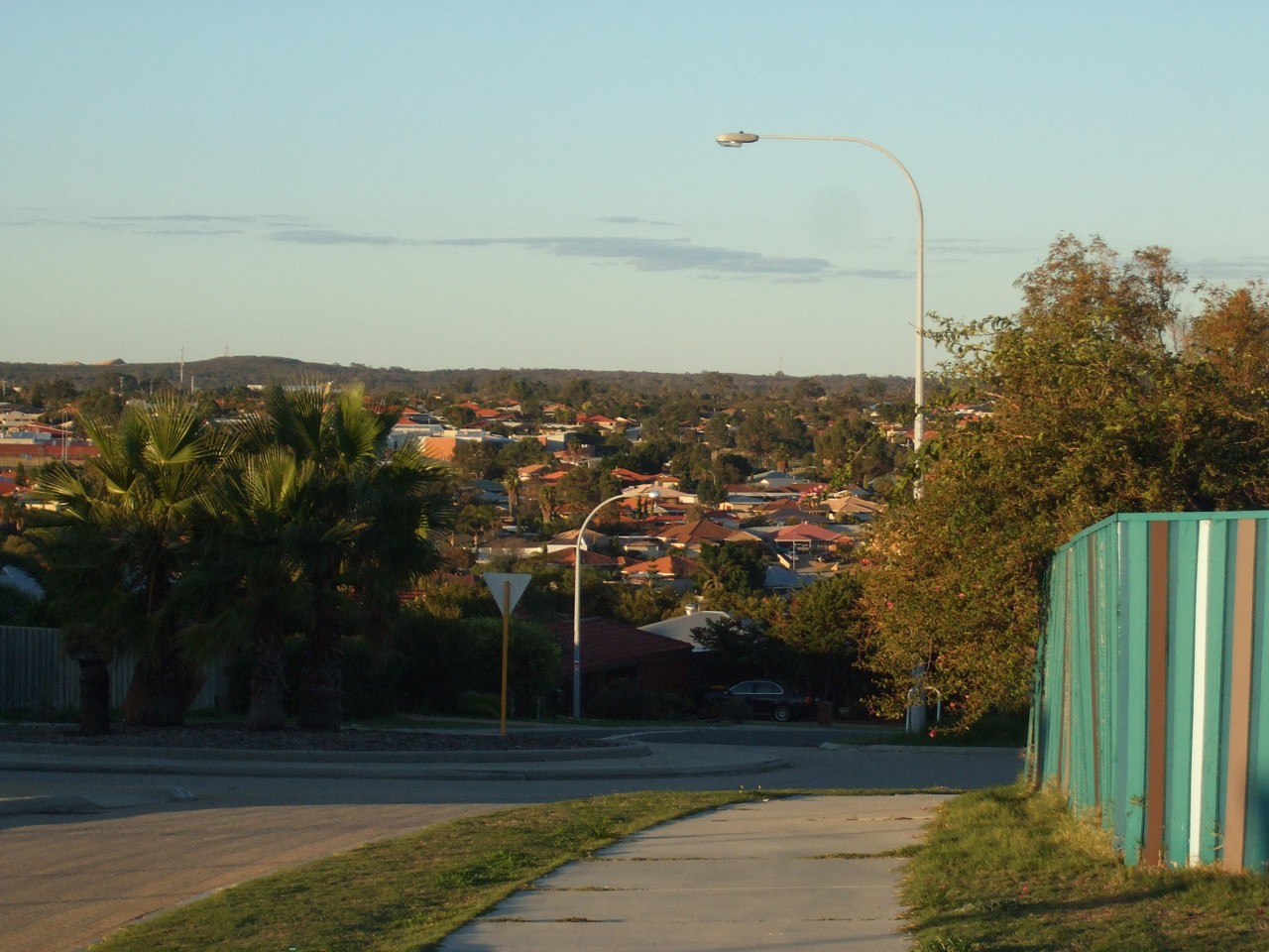 Clarkson, WA, Suburban street with distant houses and trees
