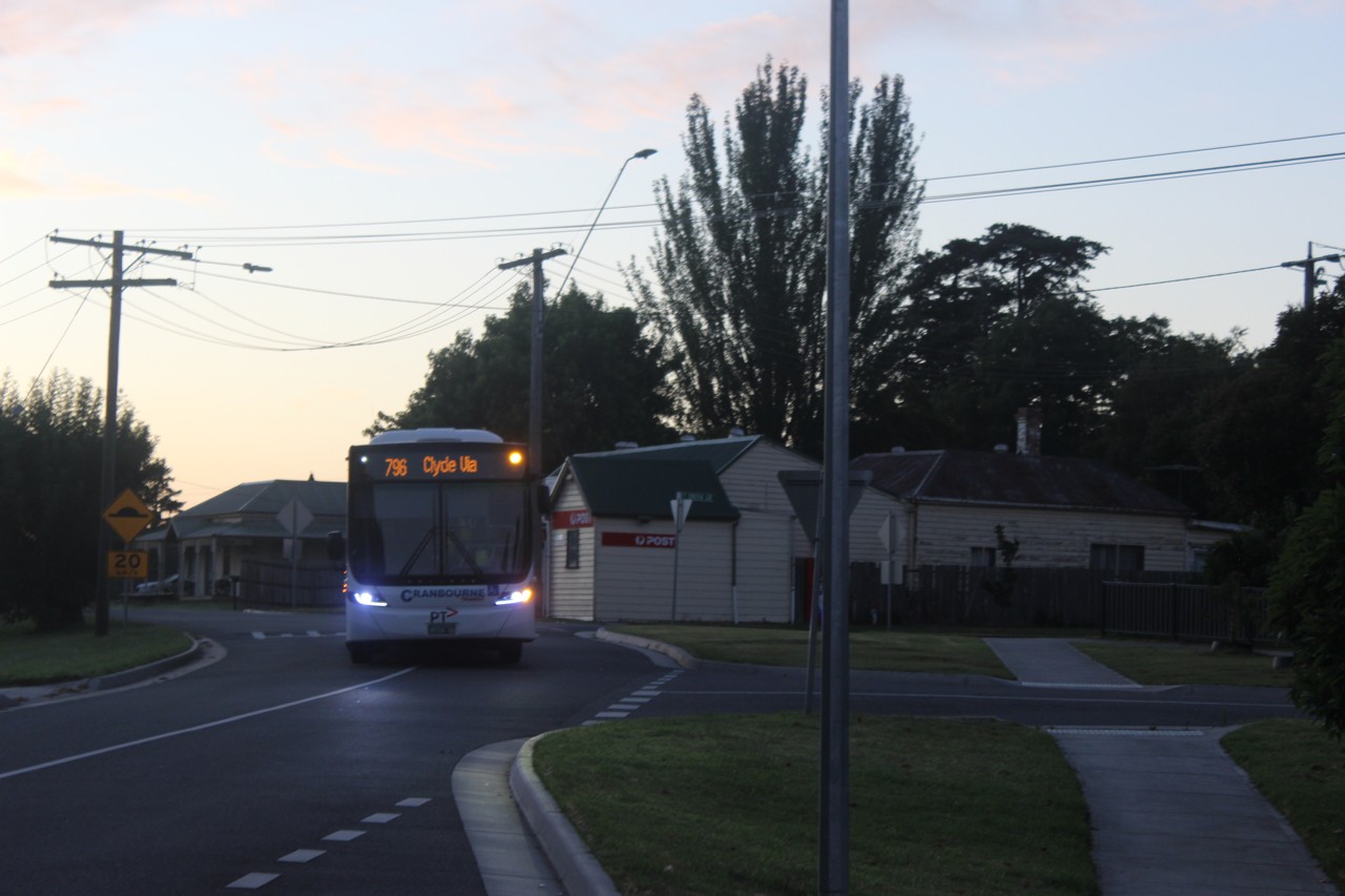 Clyde, VIC, Bus on suburban street at dusk