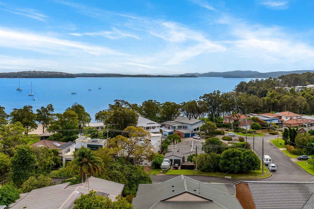 Corlette, NSW, Residential area with boats on the water