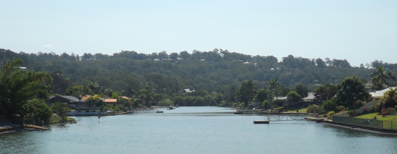 Currumbin Waters, QLD, Residential canal with homes and trees