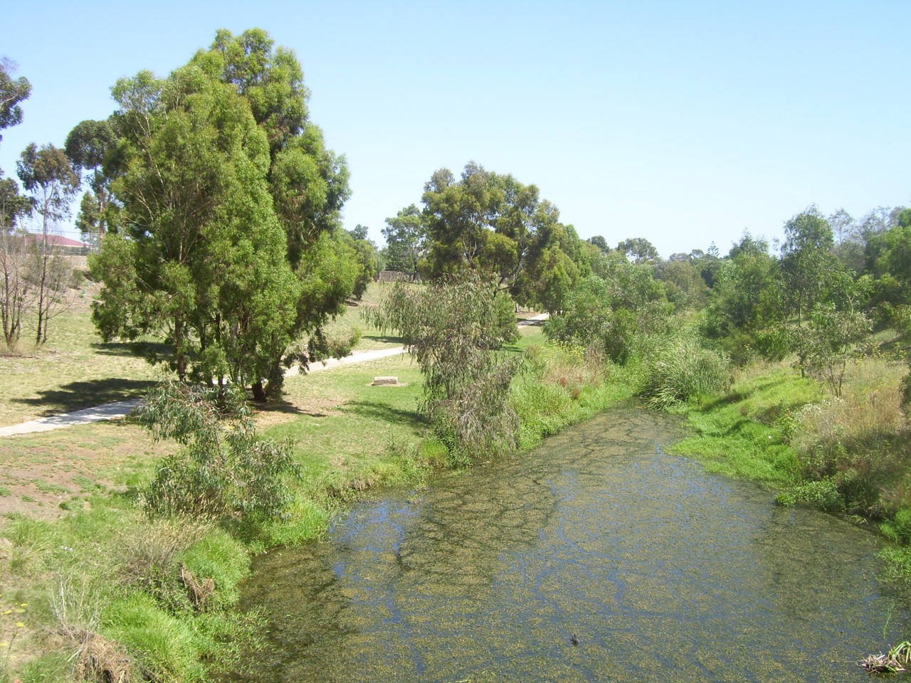 Deer Park, VIC, Creek with walking path and trees