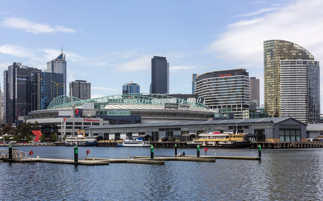 Docklands, VIC, Marvel Stadium with city skyline and docks