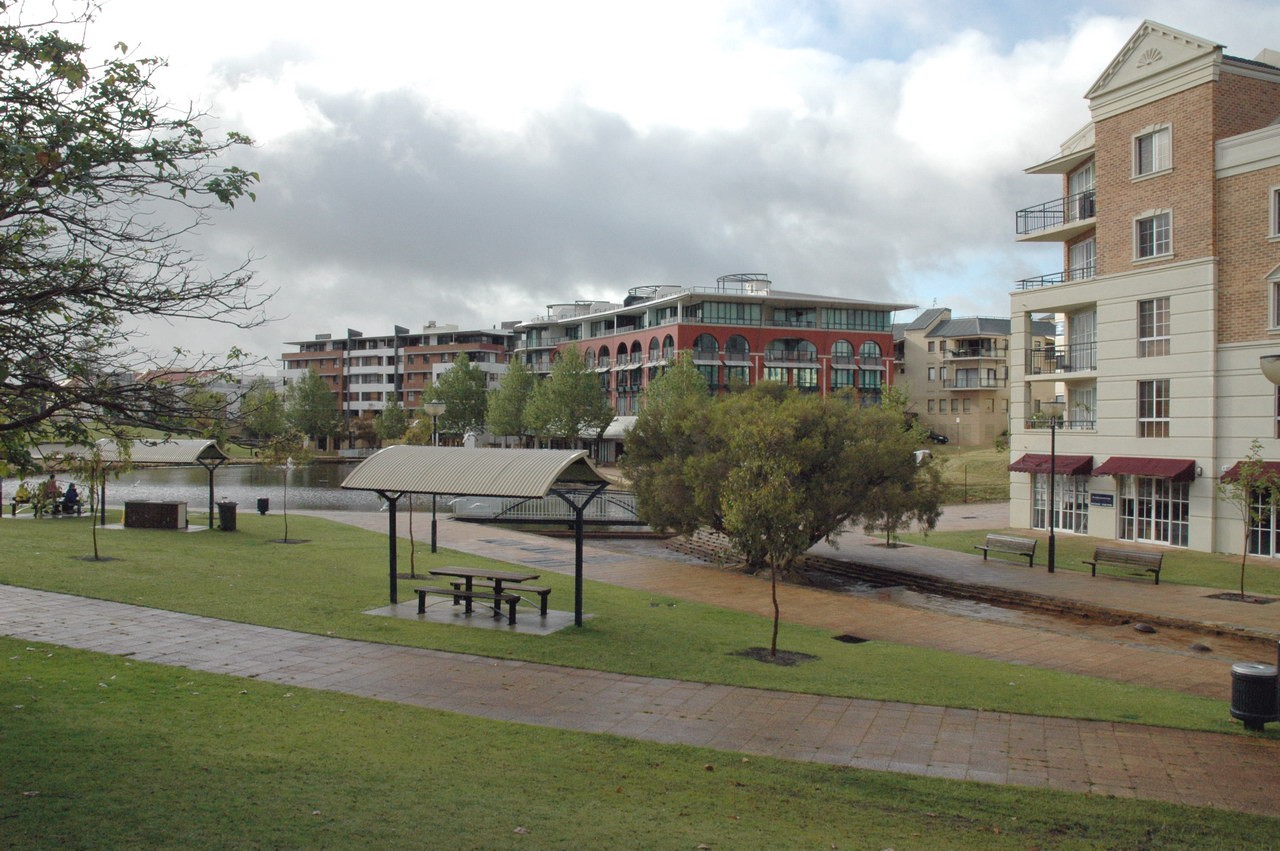 East Perth, WA, Apartments and park along a riverside path