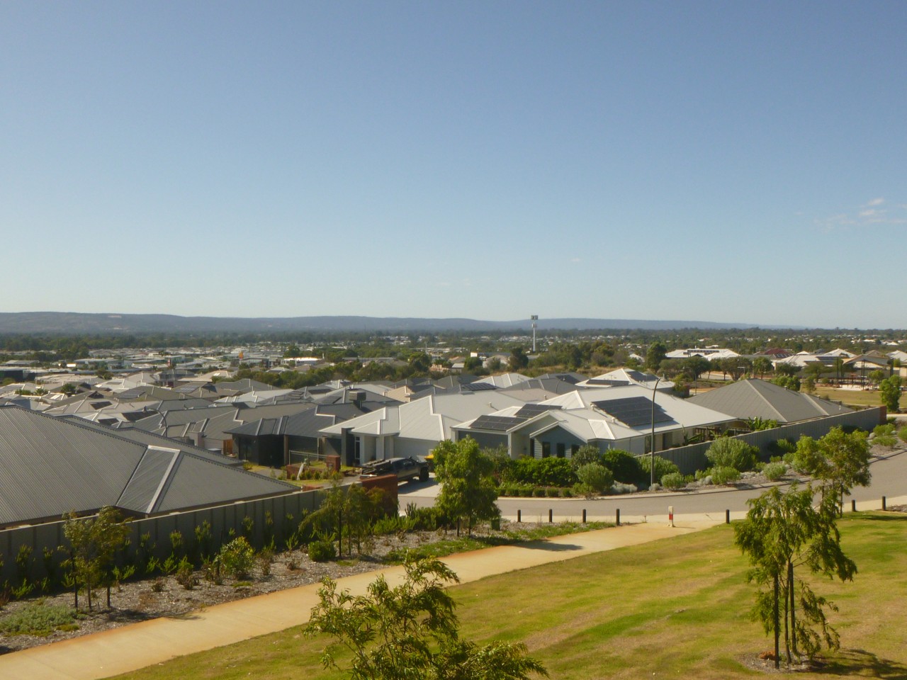Ellenbrook, WA — Residential rooftops with distant hilly landscape