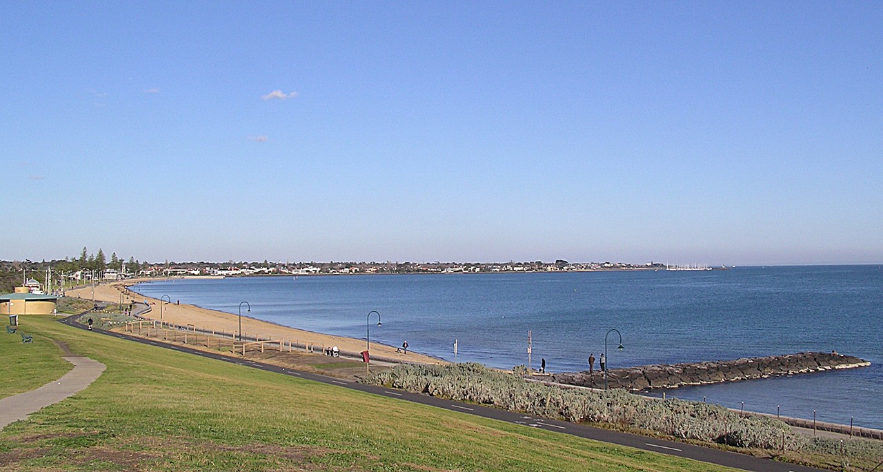 Elwood, VIC, Sandy beach with walking path and breakwater