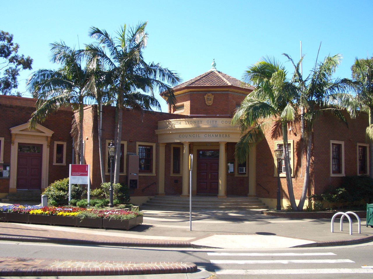 Erskineville, NSW, Brick building with palm trees and entrance