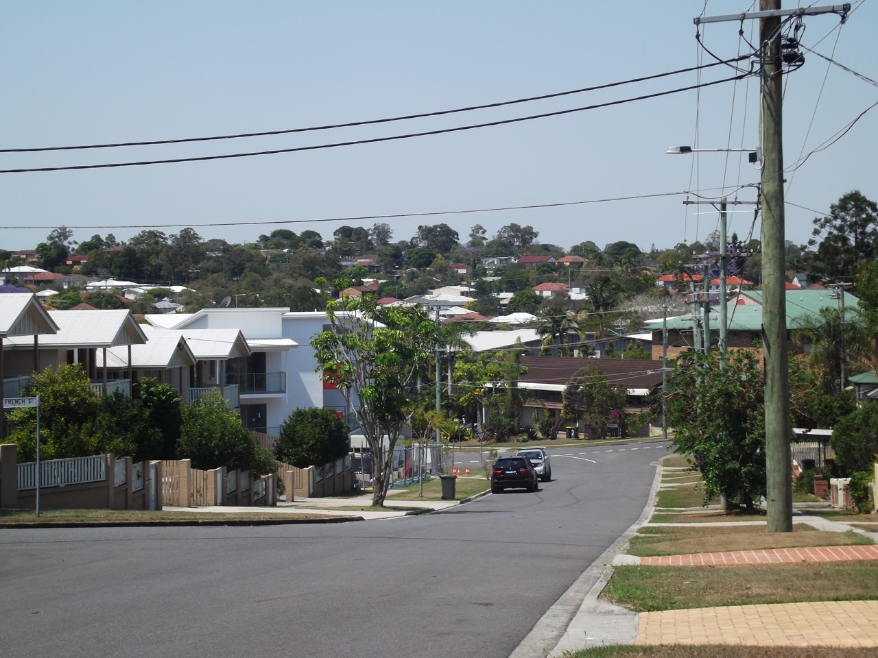 Everton Park, QLD, Residential street with houses and power lines