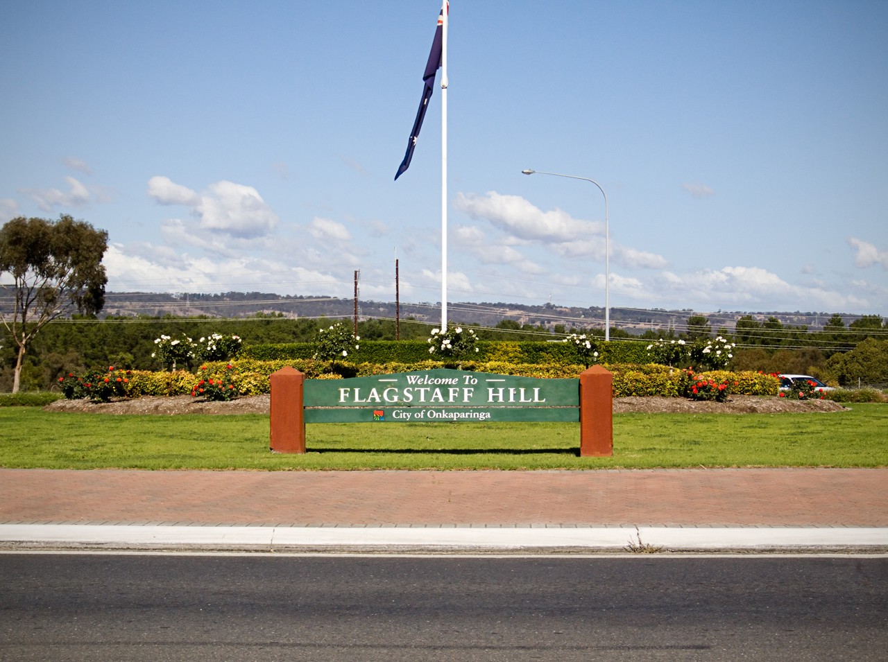 Flagstaff Hill, SA, Welcome sign with Australian flag in garden