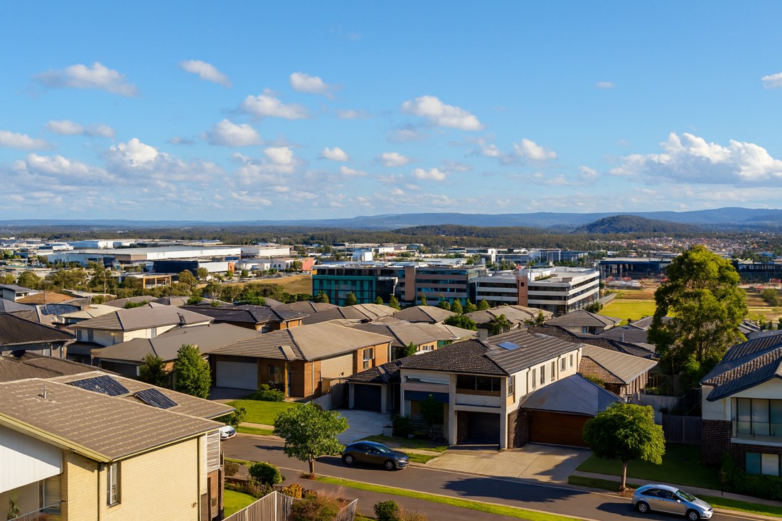 Gledswood Hills, NSW, Residential suburb with houses and distant hills