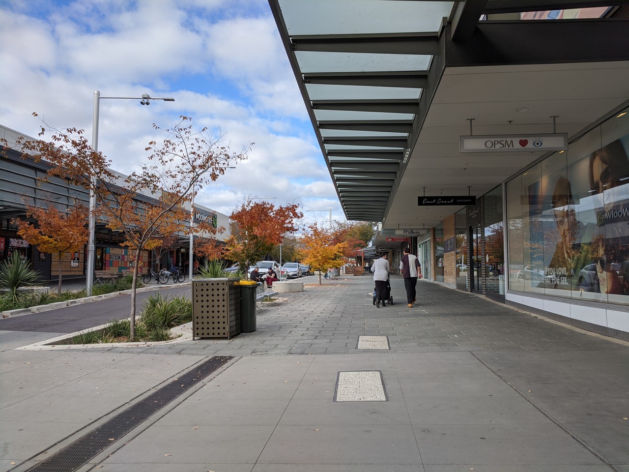 Gungahlin, ACT, Shopping street with autumn trees and pedestrians