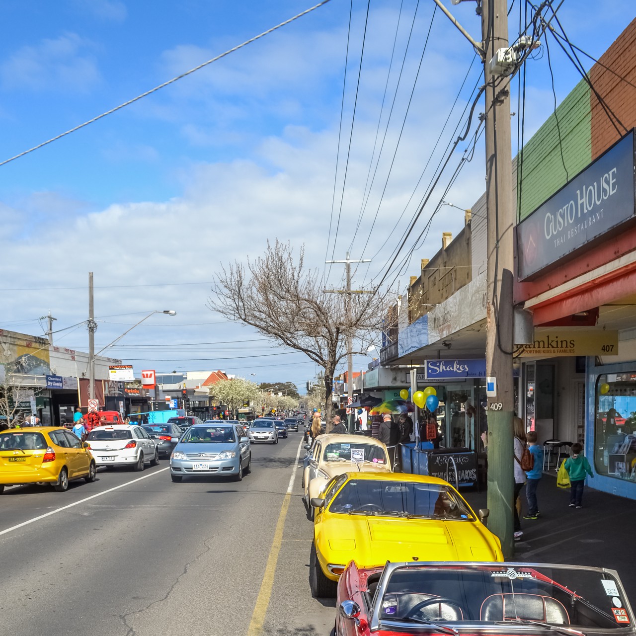Hampton, VIC, Shopfronts and parked cars on main street