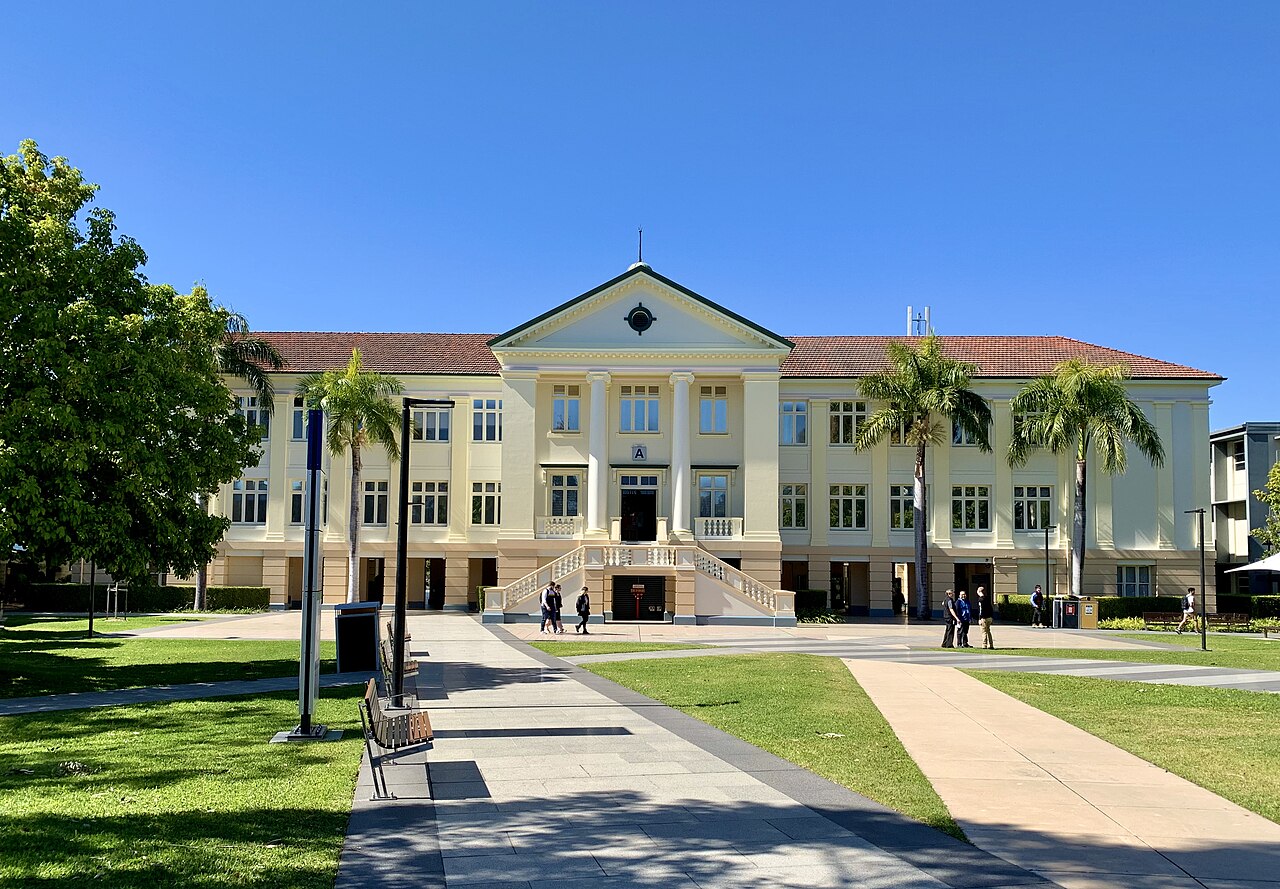 Kelvin Grove, QLD, Historic school building with palm trees