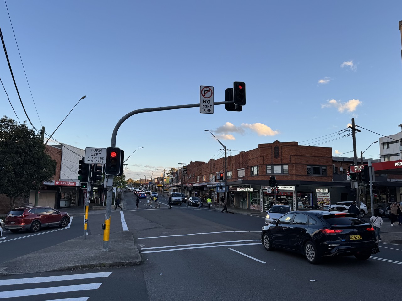 Kingsgrove, NSW, Intersection with shopfronts and traffic lights