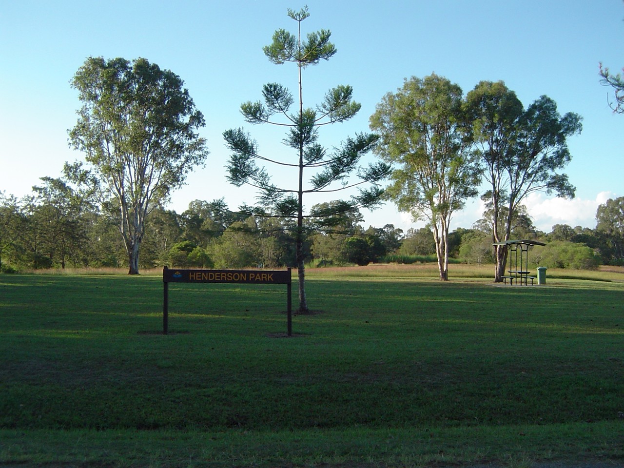 Logan Reserve, QLD, Alexander Clark Park with trees and sign