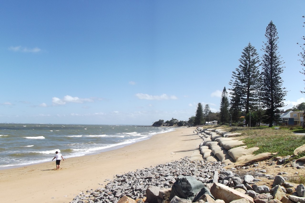 Margate, QLD, Beach with rocks and trees near shoreline