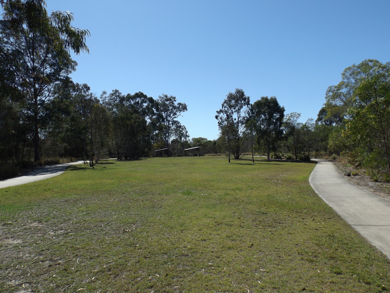 Marsden, QLD, Open grassy park area with walking paths