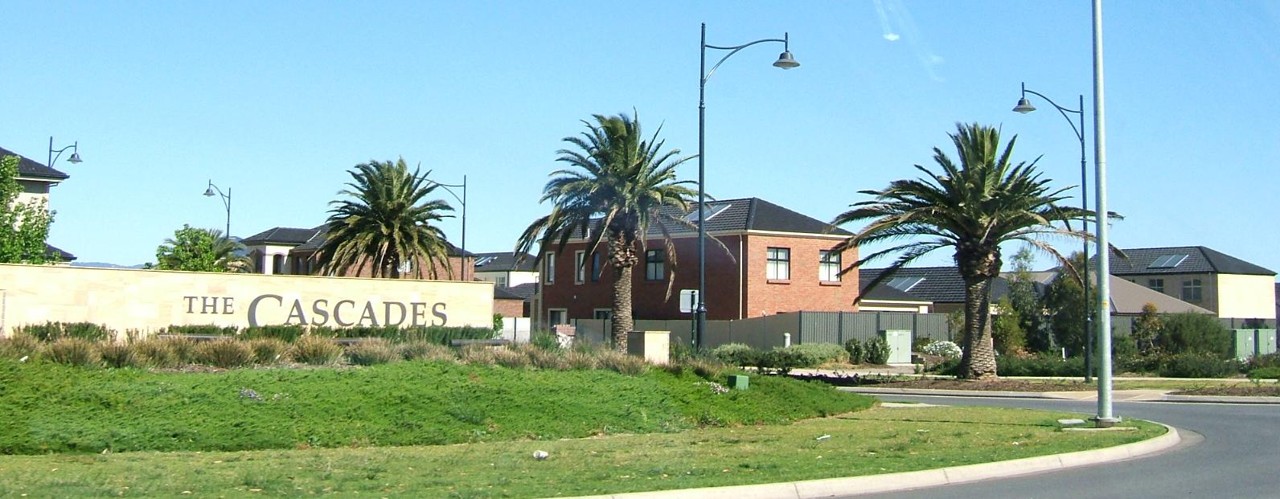 Mawson Lakes, SA, Entrance sign and palm trees by road