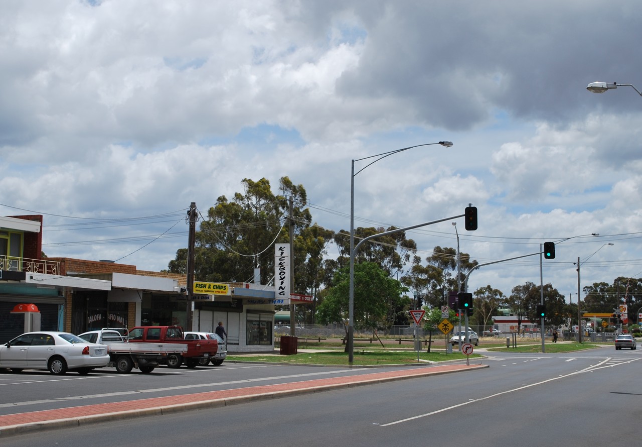 Melton South, VIC, Intersection with shops and traffic lights