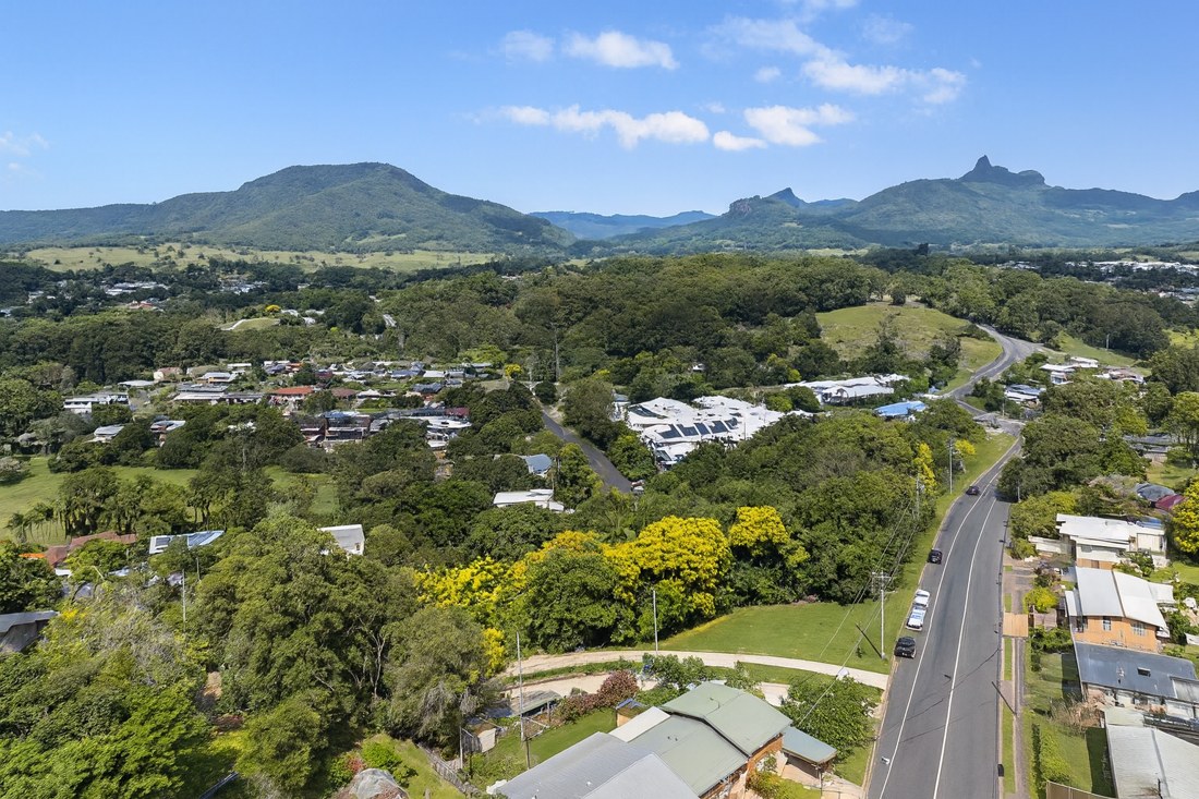 Murwillumbah, NSW, Aerial view of countryside with distant mountains