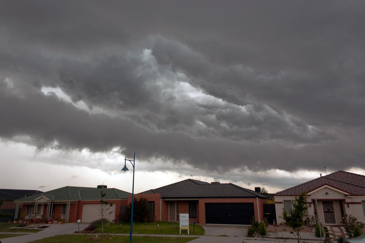 Narre Warren, VIC, Residential street under dark storm clouds