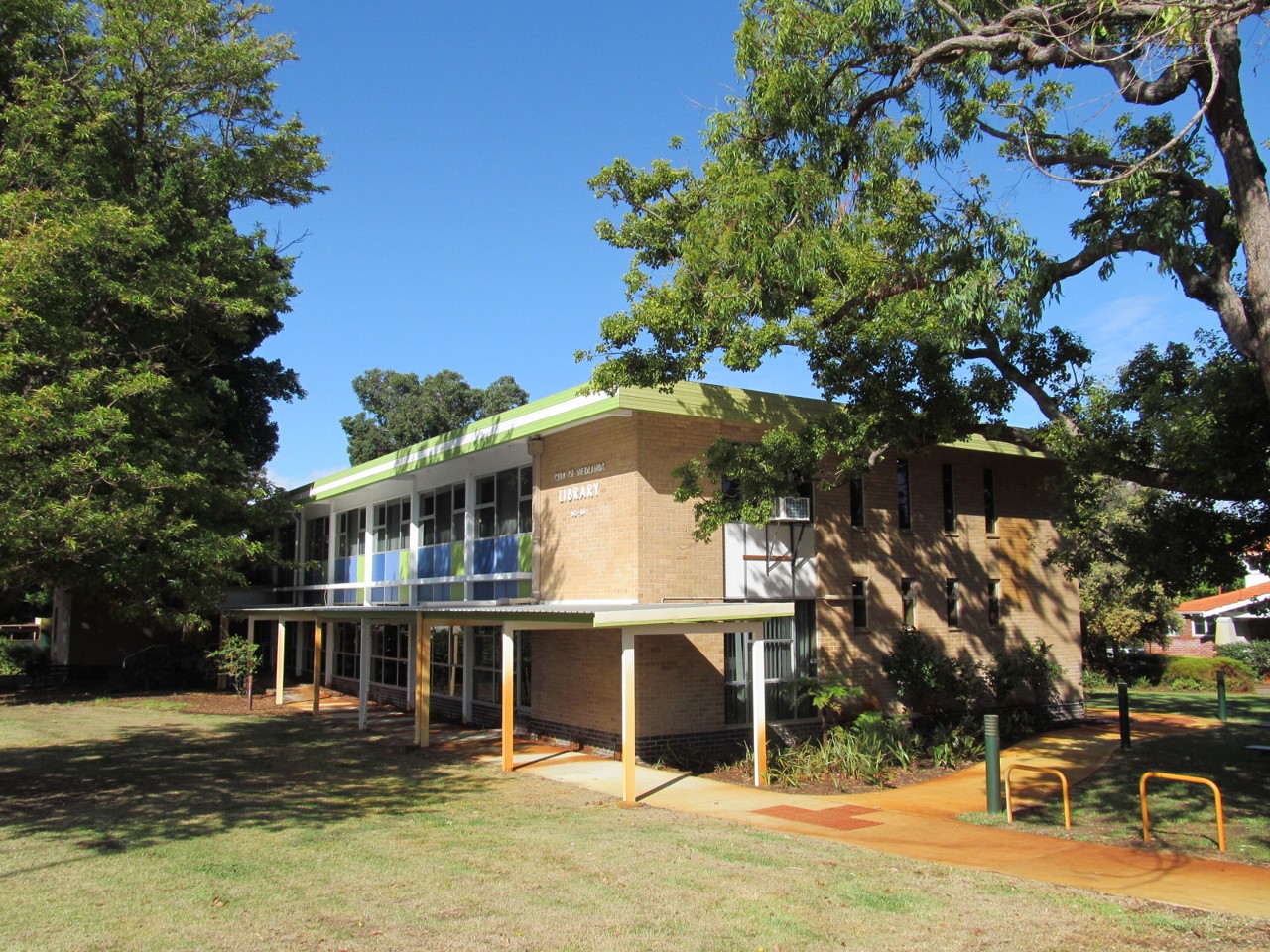 Nedlands, WA — Modern two-storey building amid large trees