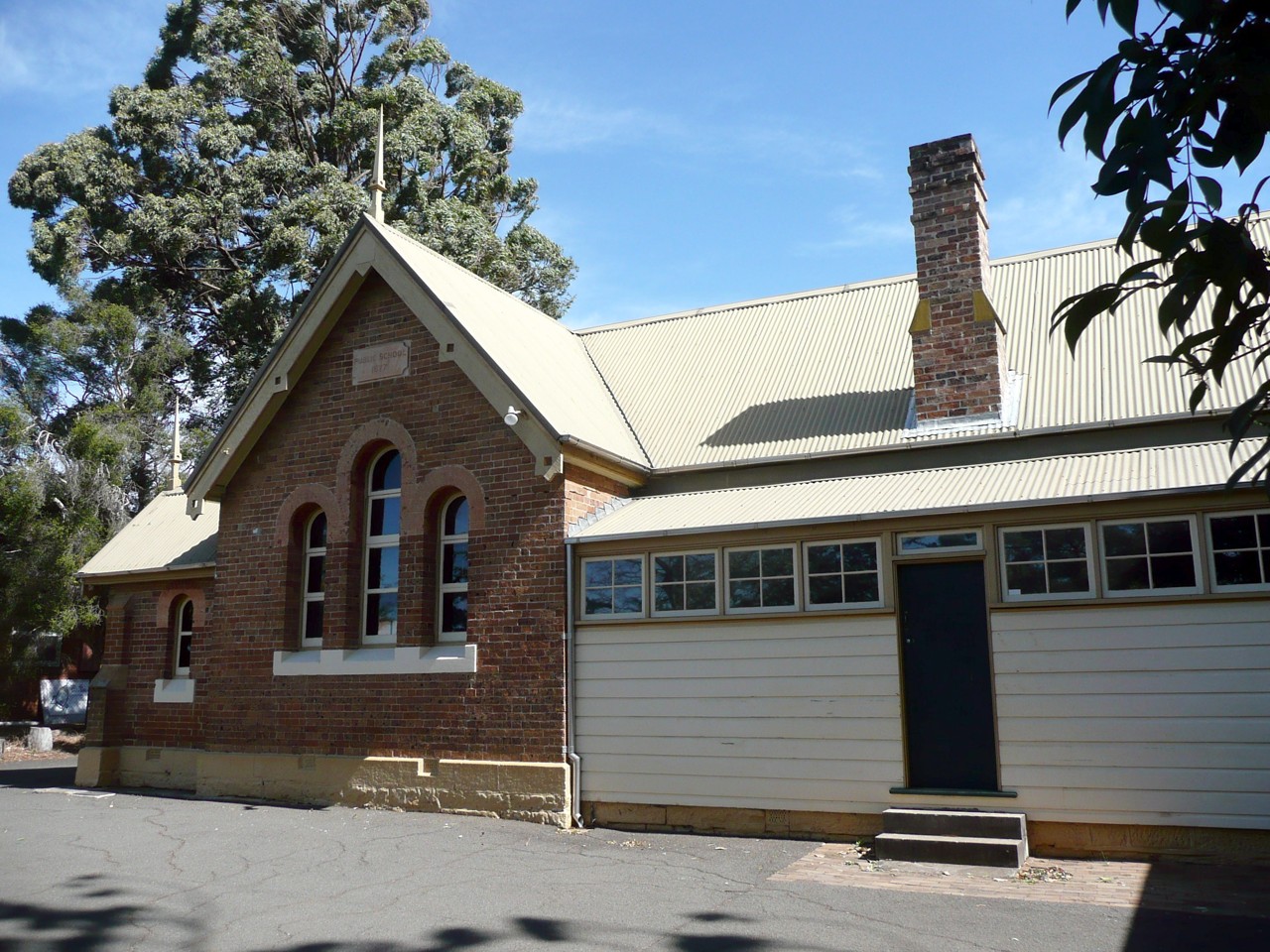 North Ryde, NSW, Historic brick schoolhouse with large arched windows
