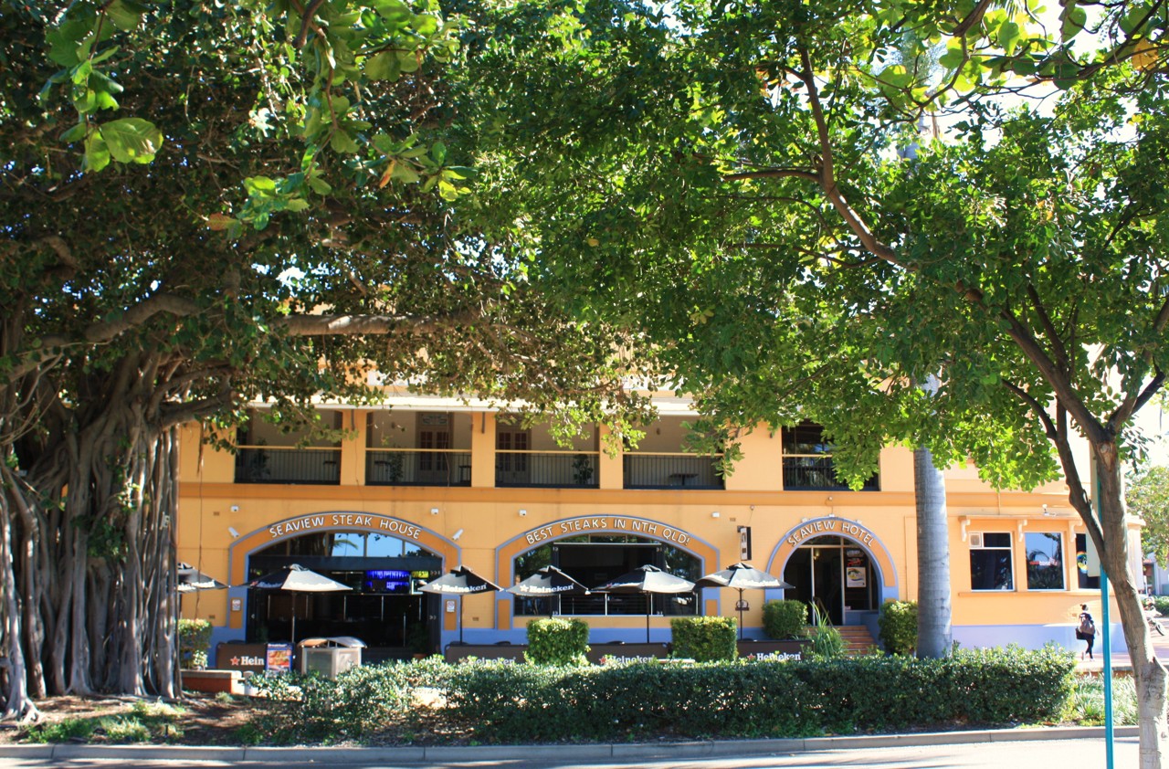 North Ward, QLD, Large building with outdoor seating under trees