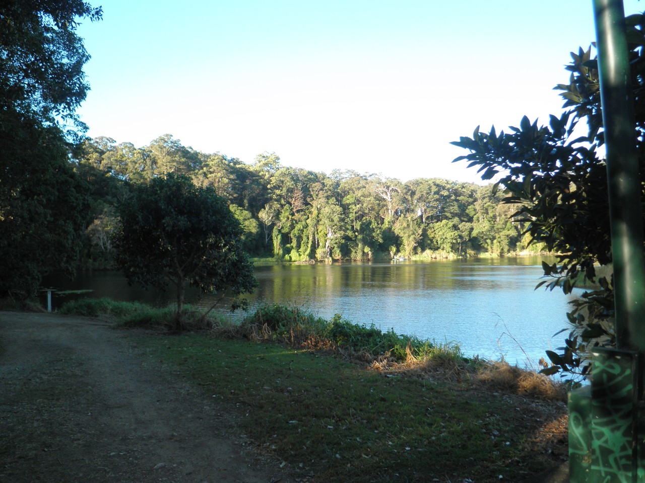 Oxenford, QLD, Dirt path beside a forested lake