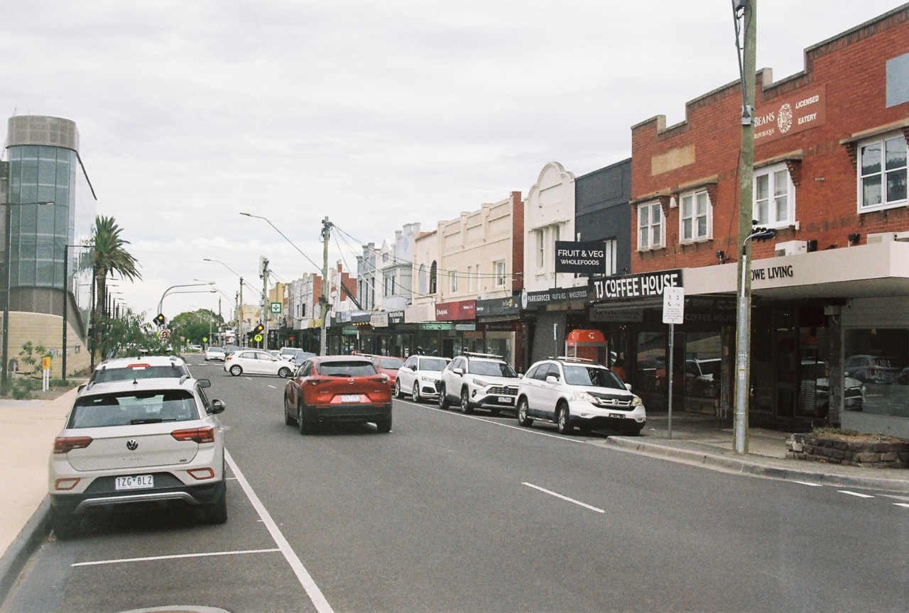 Parkdale, VIC, Shopfronts along a main street with parked cars