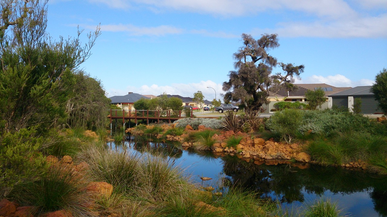 Piara Waters, WA, Residential houses along a small pond