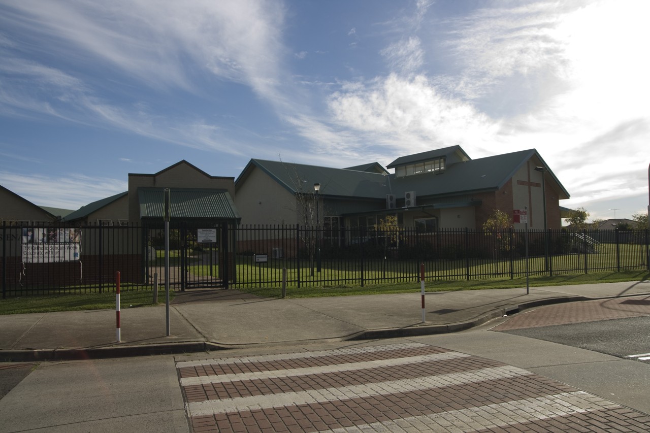 Prestons, NSW, School building behind a fenced yard
