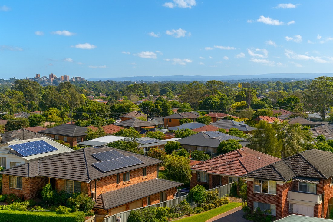 Quakers Hill, NSW, Suburban rooftops with trees and distant hills