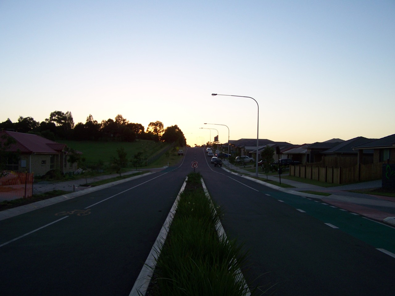 Redbank Plains, QLD, Residential street with houses at sunset