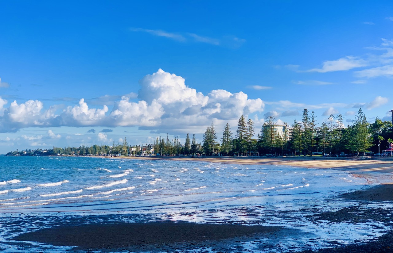 Redcliffe, QLD, Sandgate beachfront with waves and trees