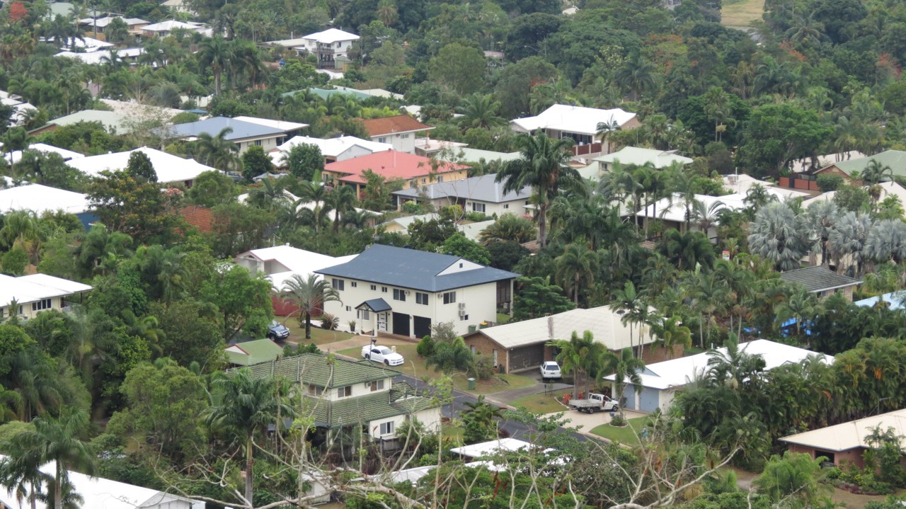 Redlynch, QLD, Residential rooftops amidst tropical greenery